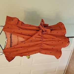 Orange attire with small navy boats beautiful